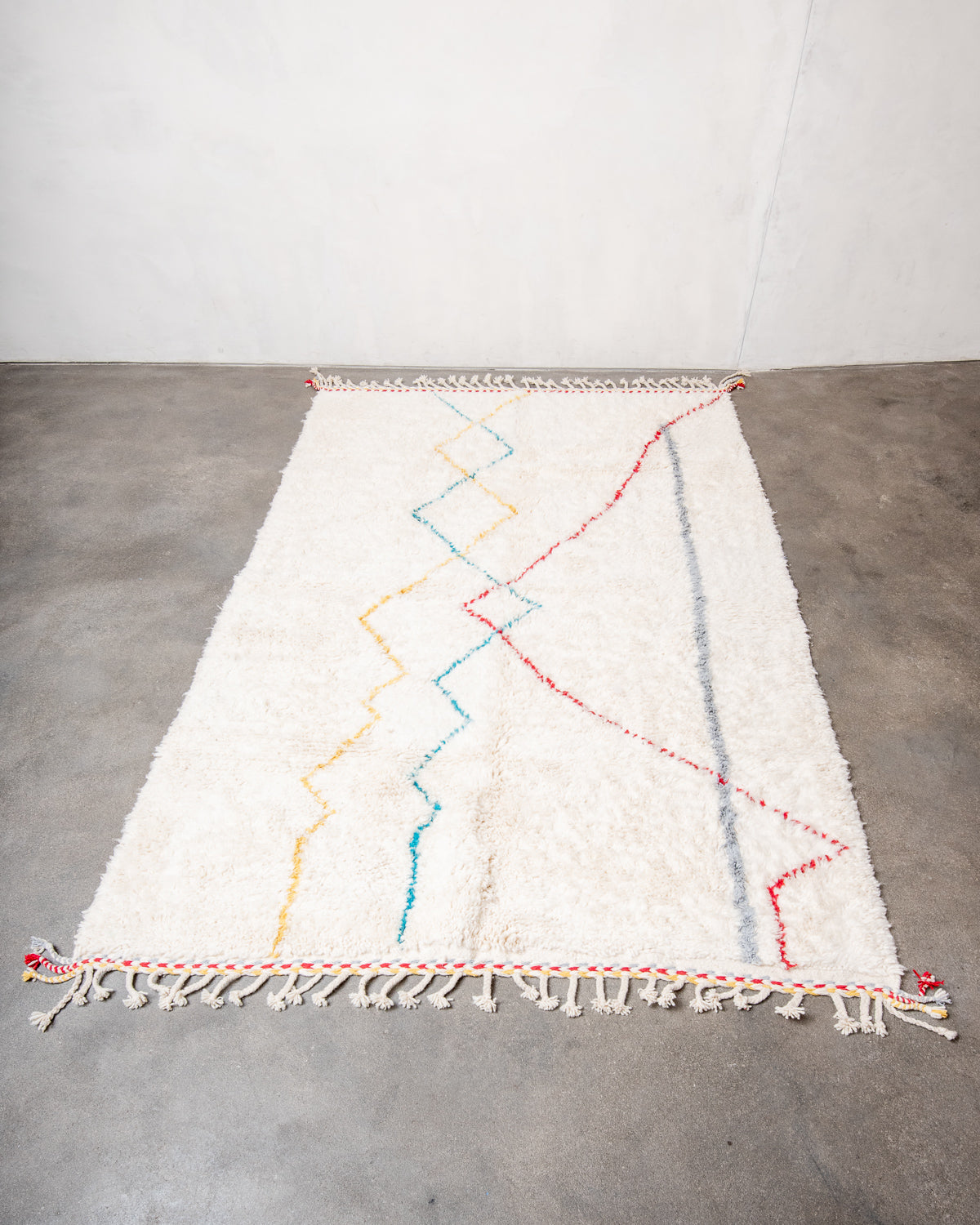 Modern, designer, handcrafted Berber rug from Morocco. Beniourain carpet with beautiful colours and patterns and fluffy wool texture.